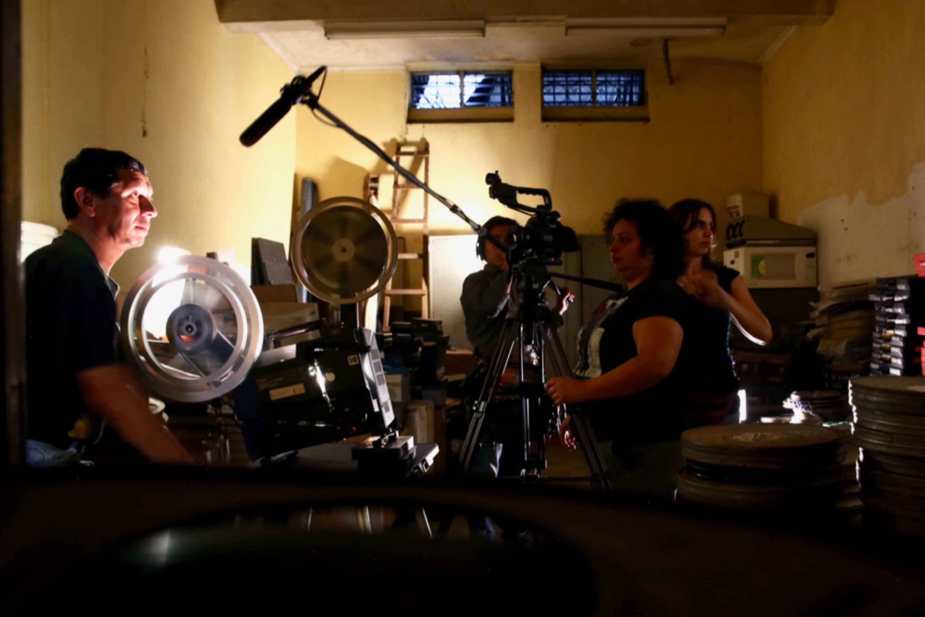 Taracena, right, with her film crew on the set of "The Silence of the Mole," at the National Film Archive in Guatemala City. Producing the film took seven years prior to its release in 2021. Photo: Courtesy Anaïs Taracena