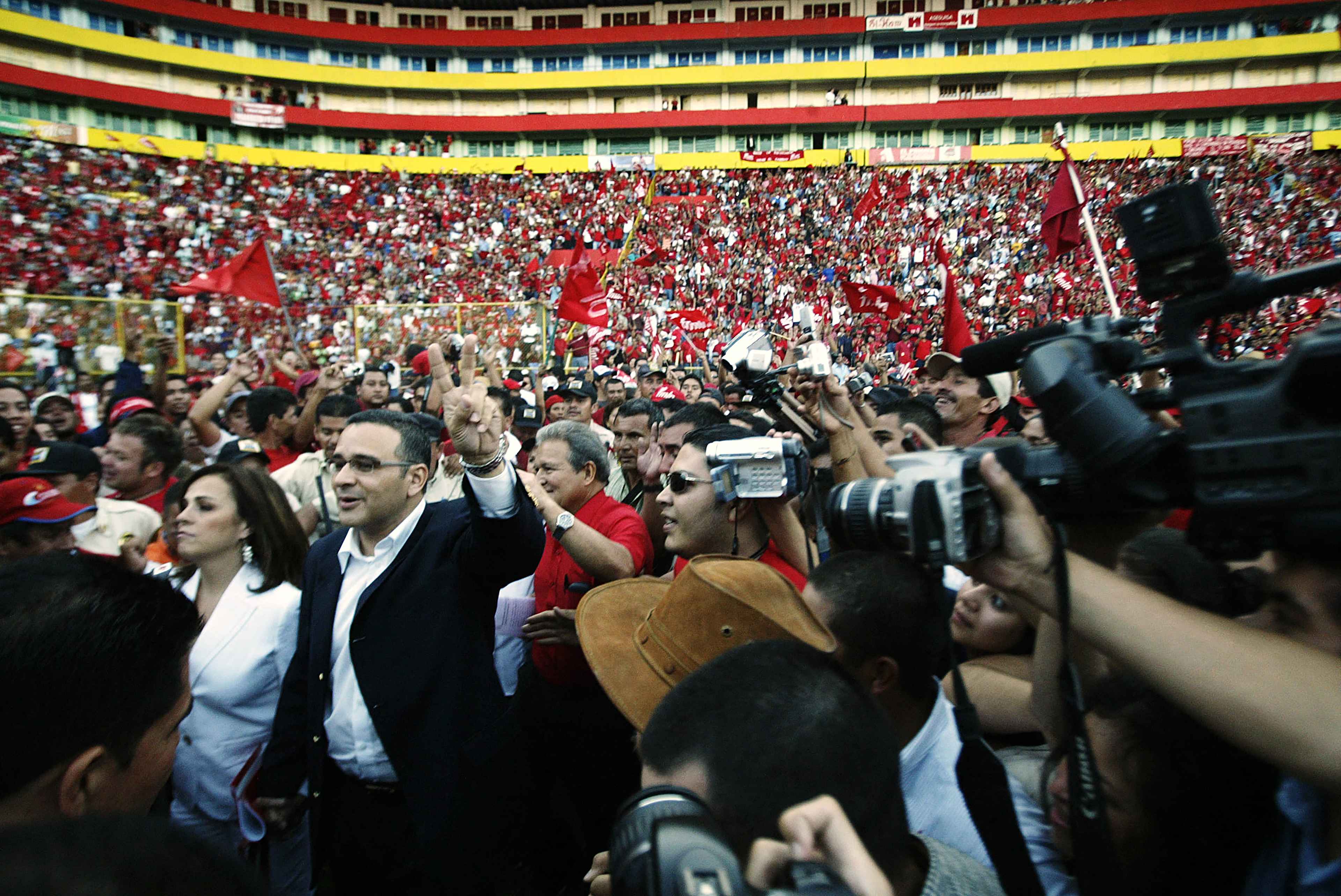 The presidential candidate of El Salvador's Farabundo Martí National Liberation Front (FMLN), TV journalist Mauricio Funes (second from left), arrives at the party’s National Convention at Cuscatlán Stadium in San Salvador on Nov. 11, 2007, during the proclamation of the presidential election season for the March 2009 elections. Photo José Cabezas/AFP