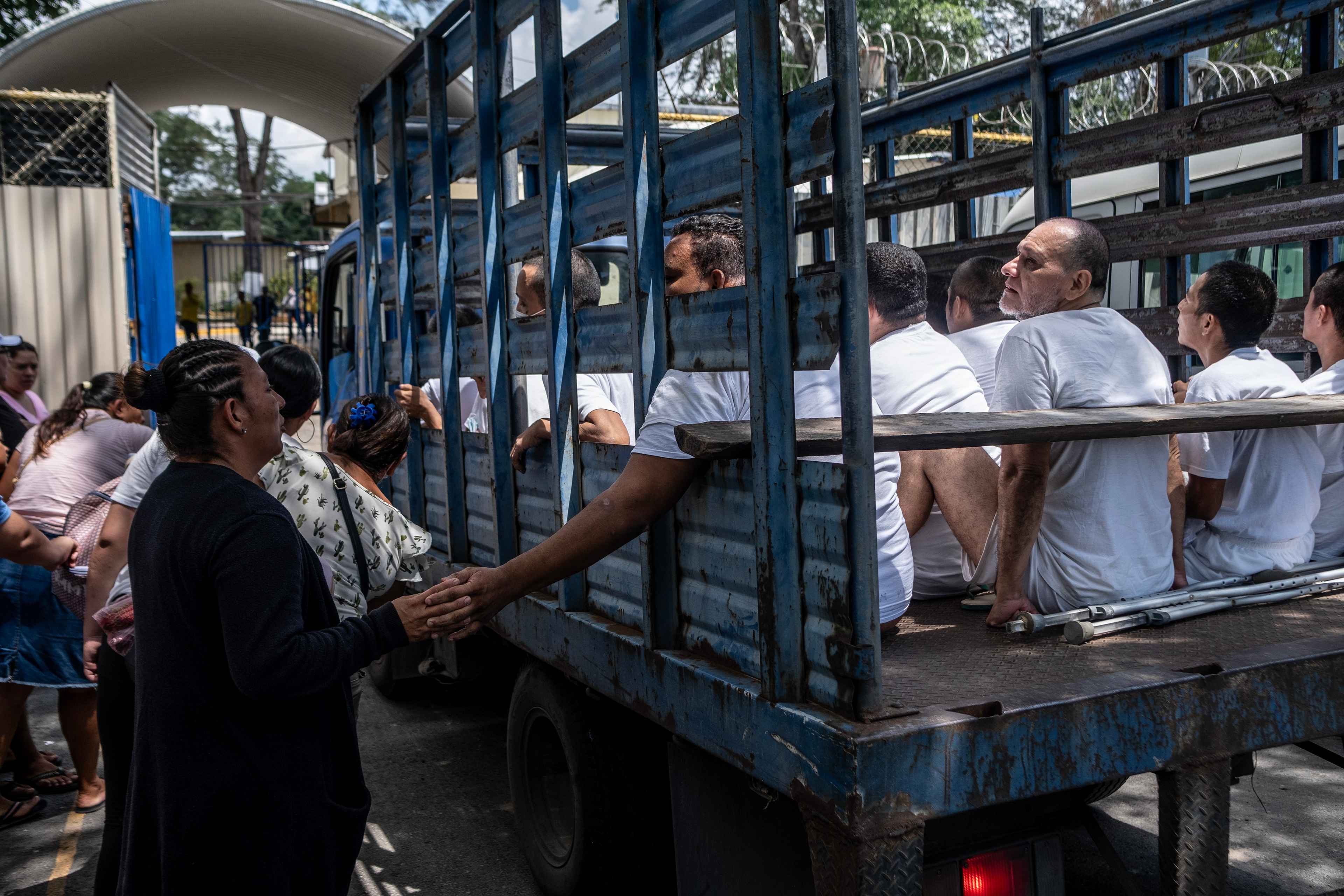 In September 2022, a truck prepares to carry a group of arrested men to Ilopango Prison as family members say goodbye. In El Salvador, incarcerated people are held officially incommunicado with their relatives, though corruption networks have emerged trafficking access to detained individuals. Photo Carlos Barrera